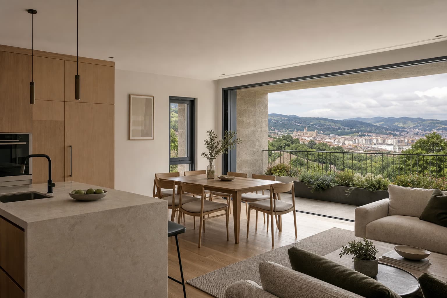 Salón abierto a una terraza con vistas a Oviedo